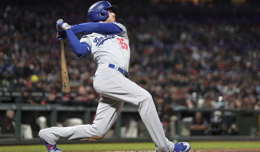 FILE - This Sept. 27, 2019, file photo shows Los Angeles Dodgers' Cody Bellinger (35) getting a hit against the San Francisco Giants during a baseball game in San Francisco. Bellinger was well on his way to becoming the National League MVP only 60 games into last season for the Los Angeles Dodgers, already with 20 homers in that stretch before his 24th birthday. (AP Photo/Tony Avelar, File)