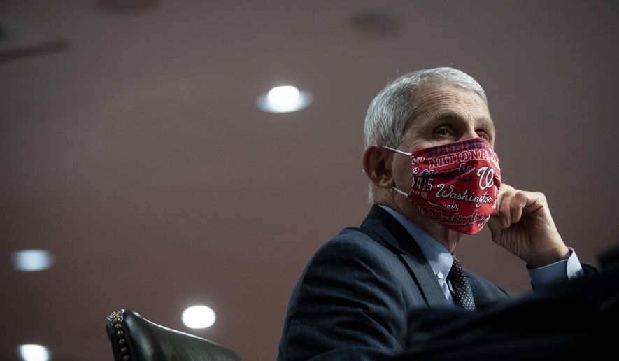 Director of the National Institute of Allergy and Infectious Diseases Dr. Anthony Fauci wears a face covering as he listens during a Senate Health, Education, Labor and Pensions Committee hearing on Capitol Hill in Washington, Tuesday, June 30, 2020. (Al Drago/Pool via AP) ** FILE **