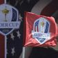 This Sept. 26, 2016, file photo shows a flag blowing in the wind before the Ryder Cup golf tournament at Hazeltine National Golf Club in Chaska, Minn. The Ryder Cup was postponed until 2021 in Wisconsin because of the COVID-19 pandemic that raised too much uncertainty whether the loudest event in golf could be played before spectators. The announcement Wednesday, July 8, 2020, was inevitable and had been in the works for weeks as the PGA of America, the European Tour and the PGA Tour tried to adjust with so many moving parts.(AP Photo/Charlie Riedel, File)  **FILE**