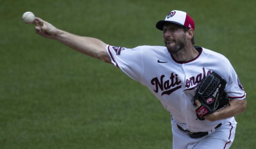 Washington Nationals starting pitcher Max Scherzer throws during a baseball training camp workout at Nationals Park, Wednesday, July 8, 2020, in Washington. (AP Photo/Alex Brandon)
