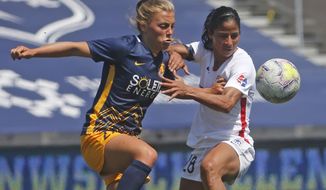 Utah Royals FC defender Madeline Nolf, left, battles with OL Reign midfielder Shirley Cruz, right, during the first half of an NWSL Challenge Cup soccer match at Zions Bank Stadium Wednesday, July 8, 2020, in Herriman, Utah. (AP Photo/Rick Bowmer)