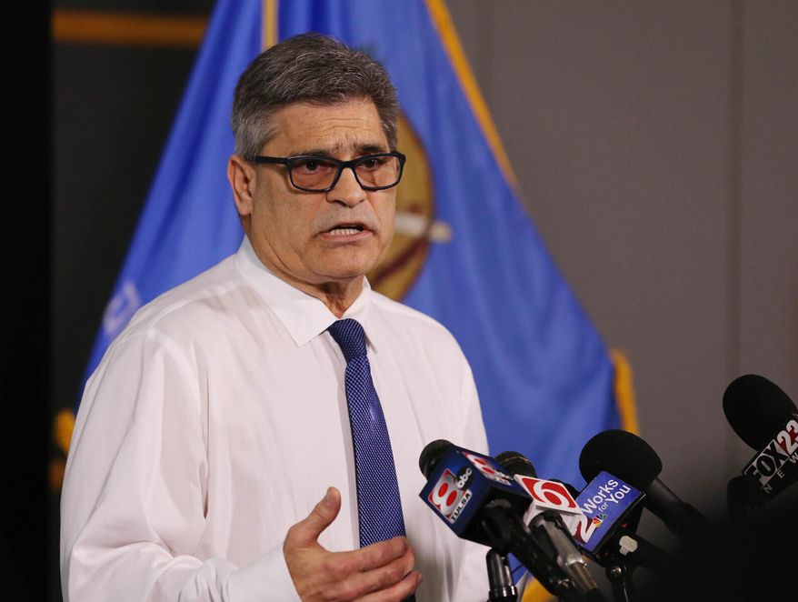 FILE - In this March 17, 2020, file photo, Tulsa Health Department director Dr. Bruce Dart takes part in a news conference in Tulsa, Oklahoma. President Donald Trump's campaign rally in Tulsa that drew thousands of people in late June, along with large protests that accompanied it, "likely contributed" to a dramatic surge in new coronavirus cases, Tulsa City-County Health Department Director Dr. Bruce Dart said Wednesday, July 8, 2020. (Tom Gilbert/Tulsa World via AP, File)