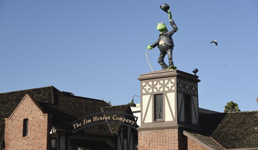 A statue of Kermit The Frog stands at the entrance to The Jim Henson Company, Tuesday, July 7, 2020, in the Hollywood section of Los Angeles. The U.S. government's small business lending program sent pandemic relief money into unexpected corners of the entertainment industry. The Muppet makers say they received about $2 million to keep their 75 workers employed through the coronavirus shutdown. (AP Photo/Chris Pizzello)