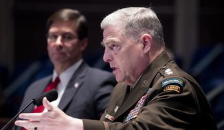 Defense Secretary Mark Esper, left, listens as Chairman of the Joint Chiefs of Staff Gen. Mark Milley testifies during a House Armed Services Committee hearing on Thursday, July 9, 2020, on Capitol Hill in Washington. (Michael Reynolds/Pool via AP) ** FILE **