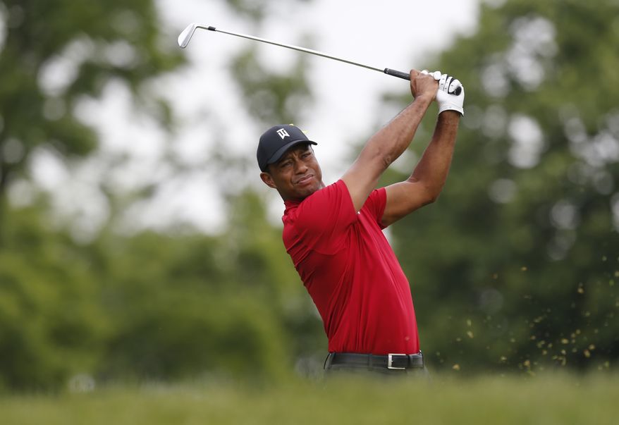 In this June 2, 2019, file photo, Tiger Woods tees off on the third hole during the final round of the Memorial golf tournament in Dublin, Ohio. The PGA Tour returned five weeks ago with some of its strongest fields. Now it gets its biggest star. Tiger Woods announced Thursday, July 9, 2020, on Twitter he will play next week at the Memorial, a tournament he has won a record five times, as he goes after his record 83rd career victory on the PGA Tour.(AP Photo/Jay LaPrete) ** FILE **