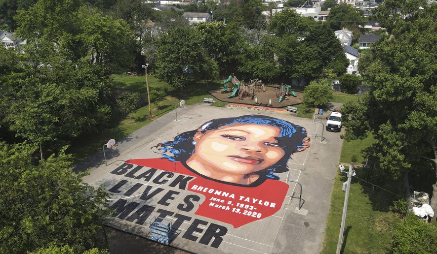 A ground mural depicting a portrait of Breonna Taylor is seen at Chambers Park, Monday, July 6, 2020, in Annapolis, Md. The mural honors Taylor, a 26-year old Black woman who was fatally shot by police in her Louisville, Kentucky, apartment. The artwork was a team effort by the Banneker-Douglass Museum, the Maryland Commission on African American History and Culture, and Future History Now, a youth organization that focuses on mural projects. (AP Photo/Julio Cortez)