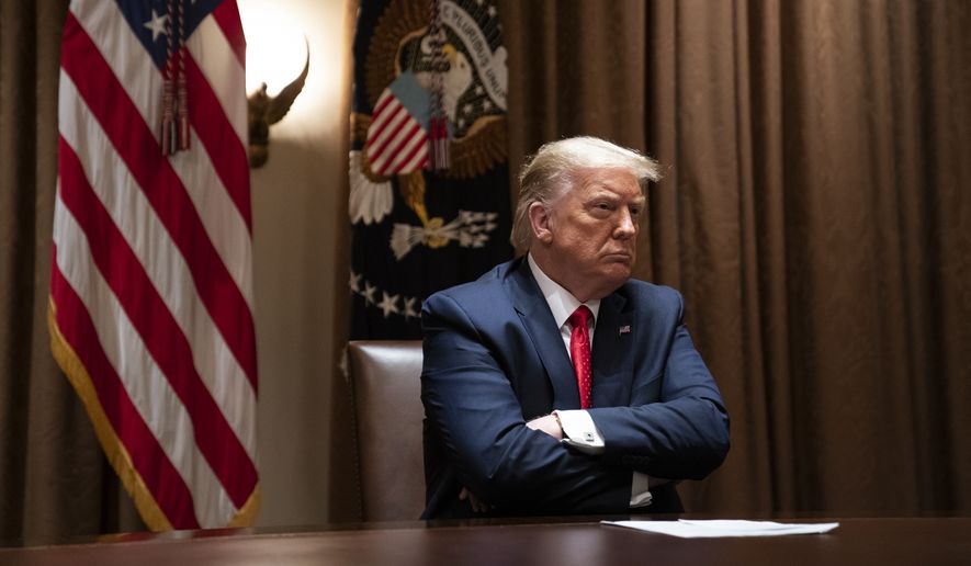 President Donald Trump listens during a meeting with Hispanic leaders in the Cabinet Room of the White House, Thursday, July 9, 2020, in Washington. (AP Photo/Evan Vucci) **FILE**