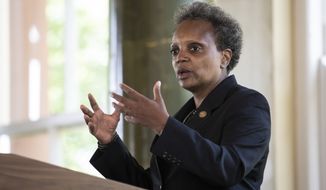 Chicago Mayor Lori Lightfoot announces the &quot;Forward Together, Building a Stronger Chicago&quot; report from the city&#39;s COVID-19 Recovery Task Force at the South Shore Cultural Center, Thursday, July 9, 2020. (Ashlee Rezin Garcia/Chicago Sun-Times via AP) **FILE**