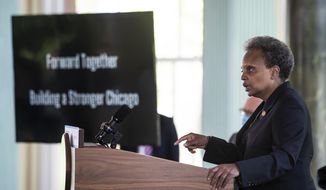 Mayor Lori Lightfoot announces the &quot;Forward Together, Building a Stronger Chicago&quot; report from the city&#39;s COVID-19 Recovery Task Force at the South Shore Cultural Center, Thursday, July 9, 2020. (Ashlee Rezin Garcia/Chicago Sun-Times via AP)