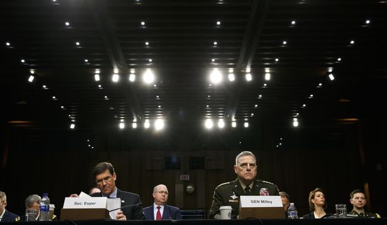 In this March 4, 2020, file photo Defense Secretary Mark Esper, left, and Chairman of the Joint Chiefs of Staff Gen. Mark Milley, listen during a Senate Armed Services Committee on budget posture on Capitol Hill in Washington. Esper and Milley are going before Congress for the first time in months to face a long list of controversies, including their differences with President Donald Trump over the handling of protests near the White House last month during unrest triggered by the killing George Floyd in police hands. (AP Photo/Jacquelyn Martin, File)