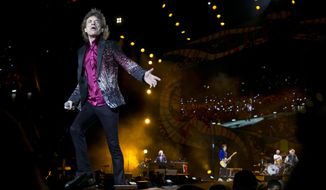 FILE - In this March 25, 2016 file photo, Rolling Stones frontman Mick Jagger performs in Havana, Cuba. The Rolling Stones are releasing a new version of their 1973 album “Goats Head Soup” with three unheard tracks. One of the new tracks is called “Scarlet” and features Led Zeppelin guitarist Jimmy Page. The album coming out on Sept. 4, 2020 will have a four-disc CD and vinyl box set edition with ten bonus tracks. The Stones also released a video for one of the unheard songs, called “Criss Cross.” (AP Photo/Enric Marti, File)