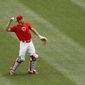 Philadelphia Phillies&#39; J.T. Realmuto warms up in the outfield during baseball practice at Citizens Bank Park, Tuesday, July 7, 2020, in Philadelphia. (AP Photo/Matt Slocum)