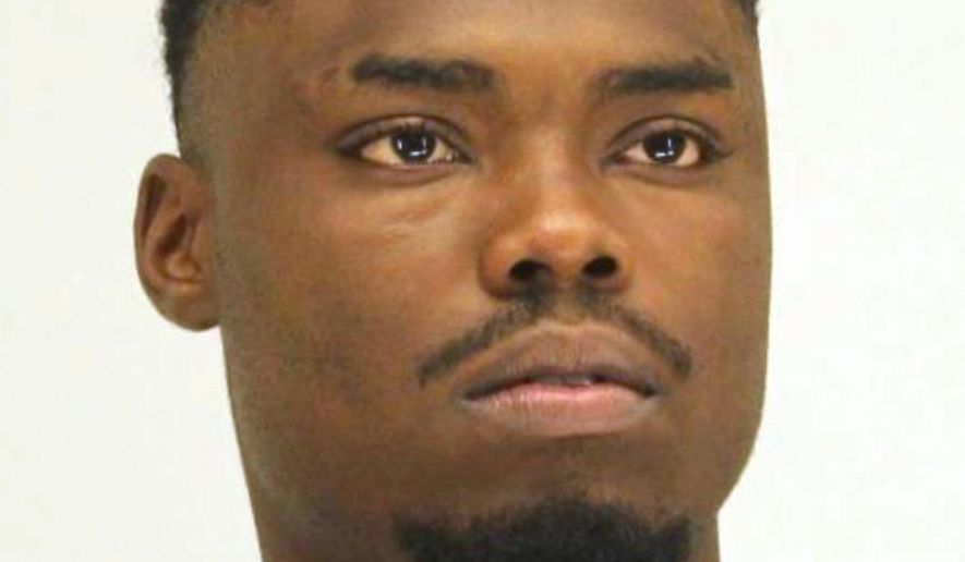 This booking photo provided by the Dallas County Sheriff's Department shows Angelo Walker, a 20-year-old Dallas man arrested and charged with murder in the fatal shooting of a Black transgender woman. Walker was taken into custody Wednesday, July 8, 2020, and is being held in the Dallas County jail on a $900,000 bond. (Dallas County Sheriff's Department via AP)