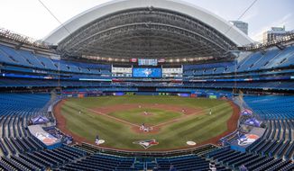 The Toronto Blue Jays play an intrasquad baseball game in Toronto on Thursday, July 9, 2020. (Carlos Osorio/The Canadian Press via AP)