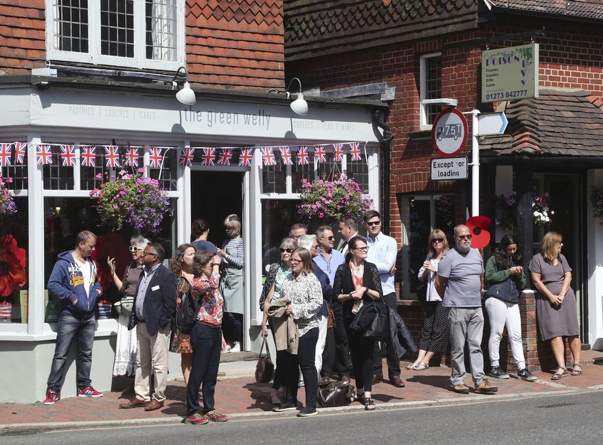 People begin to gather in Ditchling, England, ahead of the funeral for Forces Sweetheart Dame Vera Lynn, Friday July 10, 2020. The adored singer, who entertained troops with morale-boosting visits to the front line during the Second World War, died aged 103 on June 18. (Gareth Fuller/PA via AP)
