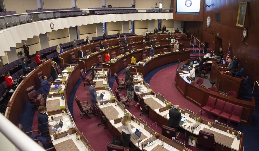 The Assembly meets on the first day of the 31st Special Session of the Nevada Legislature in Carson City, Nev., on Wednesday, July 8, 2020. Nevada lawmakers converge on the state capital for a special legislative budget session Wednesday after outbreaks of the new coronavirus were reported in Legislatures in California and Mississippi. The number of confirmed cases of COVID-19 has risen in Nevada since casinos started reopening in early June. (David Calvert via AP, Pool)