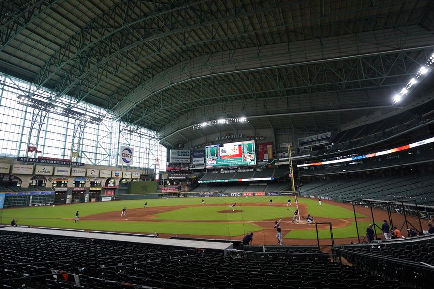 The Houston Astros play a simulated baseball game inside Minute Maid Park Thursday, July 9, 2020, in Houston. (AP Photo/David J. Phillip)