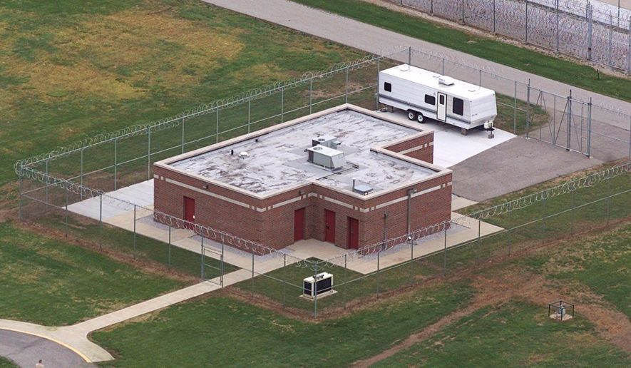 FILE - In this June 11, 2001 file photo, an aerial view of the execution facility at the United States Penitentiary in Terre Haute, Ind., is shown. After the latest 17-year hiatus, the Trump administration wants to restart federal executions this month at the Terre Haute, prison. Four men are slated to die. All are accused of murdering children in cases out of Arkansas, Kansas Iowa and Missouri. (AP Photo/Michael Conroy File)