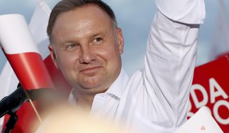In this Tuesday, July 7, 2020 photo Poland&#39;s incumbent president Andrzej Duda, who is seeking reelection in a tight presidential election runoff on Sunday, July 12, 2020 attends a rally in Lomza, Poland. Duda, who has backing from Poland&#39;s ruling right-wing party, is running against liberal Warsaw mayor, Rafal Trzaskowski. Opinion polls suggest the election may be decided by a small number of votes. (AP Photo/Czarek Sokolowski)