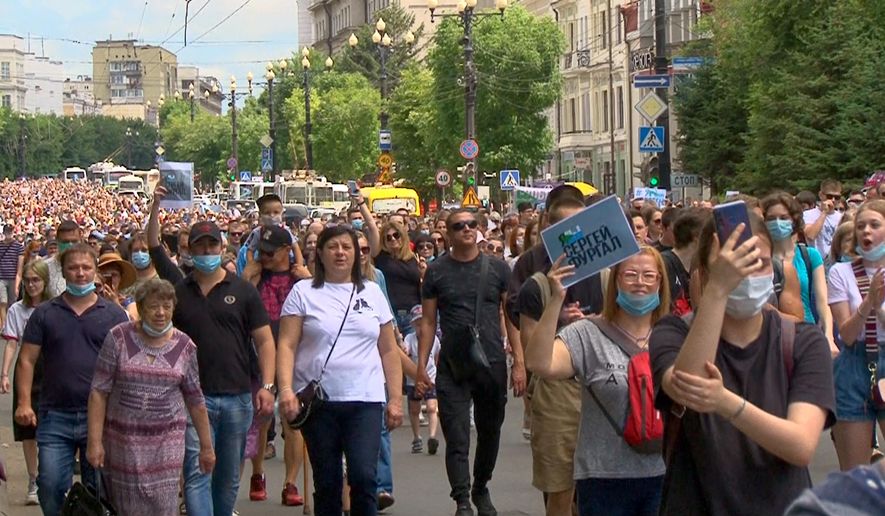 In this video grab taken from the Associated Press Television footage, people attend a protest in support of Sergei Furgal, the governor of the Khabarovsk region, who was arrested in Khabarovsk Thursday and flown to Moscow for interrogation, in Khabarovsk, Russia, Saturday, July 11, 2020. A court in Moscow ruled Friday to jail a provincial governor pending a probe on charges of his involvement in multiple murders. The arrest of Furgal, who has remained widely popular in his region, has stoked broad discontent, with a petition protesting his arrest quickly getting more than 37,000 signatures and residents of Khabarovsk staging pickets in his support. (AP Photo)