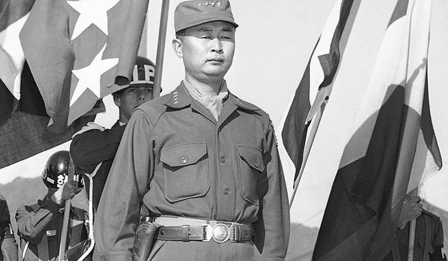 FILE - This Oct. 29, 1953, file photo shows Gen. Paik Sun-yup on the reviewing stand in South Korea. Former South Korean army Gen. Paik who was celebrated as a major war hero for leading troops in several battle victories against North Korean soldiers during the 1950-53 Korean War, has died. He was 99. (AP Photo/Fred Waters, File)