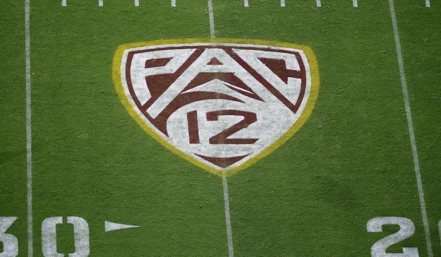 FILE - This Aug. 29, 2019, file photo shows the Pac-12 logo at Sun Devil Stadium during the second half of an NCAA college football game between Arizona State and Kent State in Tempe, Ariz. The Pac-12 has become the second major conference to shift to a conference-only fall schedule amid growing concerns over the coronavirus pandemic. (AP Photo/Ralph Freso, File)