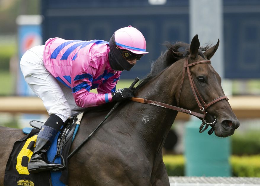 FILE - In this June 20, 2020, file photo provided by Benoit Photo, Toinette, with Flavien Prat aboard, wins the Grade III, $100,000 Wilshire Stakes horse race at Santa Anita in Arcadia, Calif. Prat has tested positive for COVID-19 after riding in Kentucky. Del Mar officials said Prat was tested Sunday, July 12, and was told shortly thereafter that he had a positive result. The 27-year-old jockey had been scheduled to ride eight horses at Del Mar on Sunday, but was removed from those mounts. He was in Kentucky to ride a day earlier. (Benoit Photo via AP, File)
