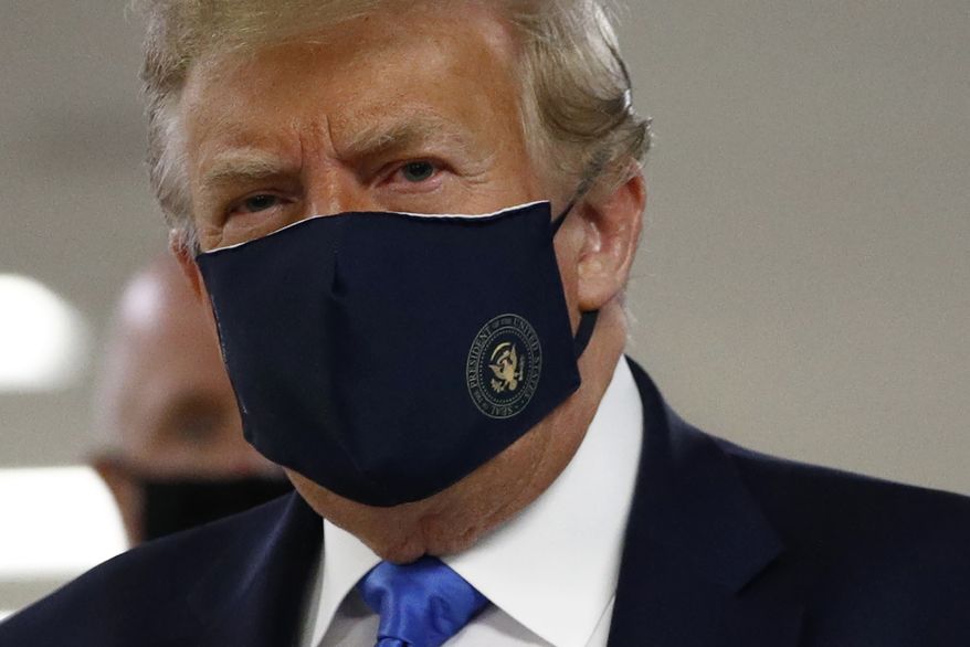 President Donald Trump wears a face mask as he visits Walter Reed National Military Medical Center in Bethesda, Md., Saturday, July 11, 2020. (AP Photo/Patrick Semansky)