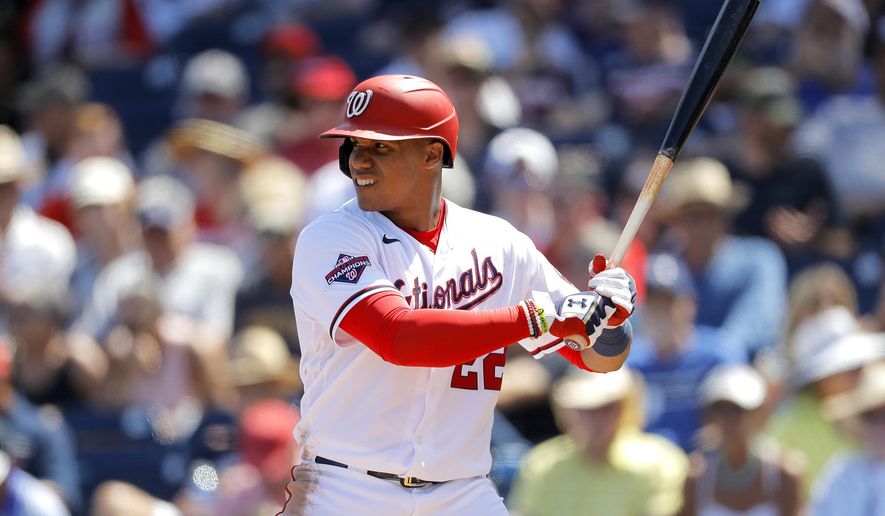 FILE - In this March 12, 2020, file photo, Washington Nationals' Juan Soto waits for a pitch from the New York Yankees during the fourth inning of a spring training baseball game, in West Palm Beach, Fla. Baseball begins Thursday, July 23, 2020, with the New York Yankees at Washington Nationals. Juan Soto and Washington open their title defense after winning the World Series for the first time in franchise history. Gerrit Cole is hoping to lead New York to its 28th championship after the ace right-hander signed a blockbuster deal with the Yankees in free agency. (AP Photo/Julio Cortez, File)