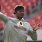 In this Dec. 22, 2019, file photo, Washington Redskins quarterback Dwayne Haskins works out prior to an NFL football game against the New York Giants, in Landover, Md. A new name must still be selected for the Washington Redskins football team, one of the oldest and most storied teams in the National Football League, and it was unclear how soon that will happen. But for now, arguably the most polarizing name in North American professional sports is gone at a time of reckoning over racial injustice, iconography and racism in the U.S. (AP Photo/Alex Brandon) ** FILE **