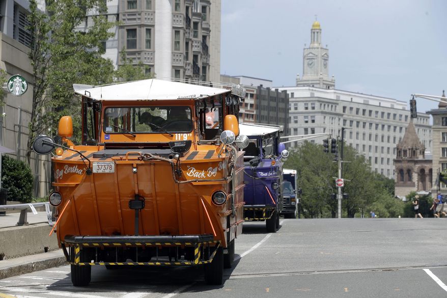 Boston's iconic duck boat tours started rolling again on Monday, July 13, 2020, as the city began Phase 3 of its coronavirus economic restart. Museums, movie theaters, historical sites and gyms in Boston were permitted to reopen Monday with certain restrictions, a week after most of the rest of Massachusetts. (AP Photo/Steven Senne)