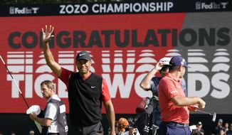 FILE - In this Monday, Oct. 28, 2019, file photo, Tiger Woods celebrates after winning the Zozo Championship PGA Tour at the Accordia Golf Narashino country club in Inzai, east of Tokyo, Japan. The tour is looking into the possibility of moving the event to the western U.S. this year because of the COVID-19 pandemic. (AP Photo/Lee Jin-man, File)
