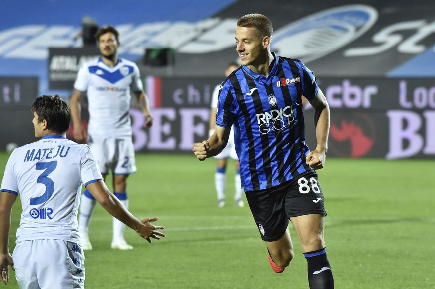 Atalanta's Mario Pasalic celebrates after scoring a goal during a Serie A soccer match between Atalanta and Brescia, at the Gewiss Stadium in Bergamo, Italy, Tuesday, July 14, 2020. (Gianluca Checchi/LaPresse via AP)