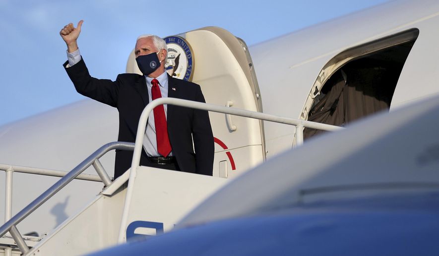 Vice President Mike Pence gives a thumbs-up before departing on Air Force Two from Philadelphia International Airport after a series of stops in Pennsylvania on Thursday, July 9, 2020. (Tim Tai/The Philadelphia Inquirer via AP, Pool)