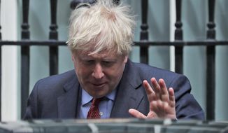 Britain&#39;s Prime Boris Johnson leaves 10 Downing Street to attend the weekly Prime Minister&#39;s Questions session, in parliament in London, Wednesday, July 15, 2020. (AP Photo/Frank Augstein)