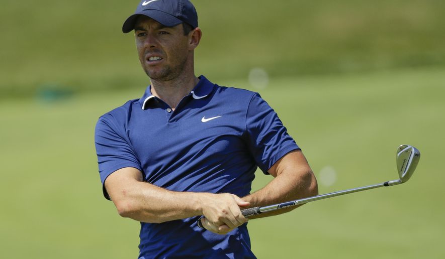 Rory McIlroy hits in the practice area during a practice round for the Memorial golf tournament, Wednesday, July 15, 2020, in Dublin, Ohio. (AP Photo/Darron Cummings)