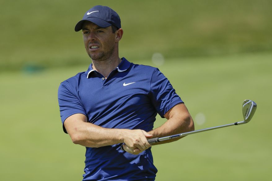 Rory McIlroy hits in the practice area during a practice round for the Memorial golf tournament, Wednesday, July 15, 2020, in Dublin, Ohio. (AP Photo/Darron Cummings)