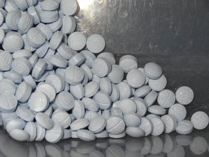 This photo provided by the U.S. Attorney&#39;s Office for Utah and introduced as evidence in a 2019 trial shows fentanyl-laced fake oxycodone pills collected during an investigation. (U.S. Attorneys Office for Utah via AP) **FILE**