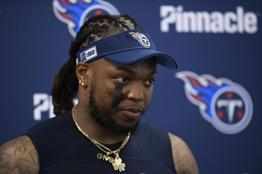 FILE - In this Jan. 11, 2020, file photo, Tennessee Titans running back Derrick Henry speaks during a media availabiltiy after of an NFL divisional playoff football game, in Baltimore. The Titans face a deadline Wednesday afternoon, July 15, 2020, of reaching an extension with NFL rushing leader Derrick Henry or let him play this season under the franchise tag he signed in April. (AP Photo/Nick Wass, File)