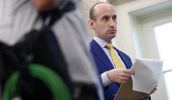 President Donald Trump&#39;s White House Senior Adviser Stephen Miller stands in the Oval Office of the White House during a law enforcement briefing on the MS-13 gang, Wednesday, July 15, 2020, in Washington. (AP Photo/Patrick Semansky)