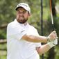 Shane Lowry, of Ireland, watches his drive on the second tee during the second round of the Workday Charity Open golf tournament, Friday, July 10, 2020, in Dublin, Ohio. (AP Photo/Darron Cummings)