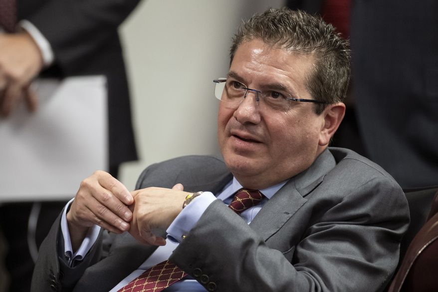 This Jan. 2, 2020, file photo shows Washington Redskins owner Dan Snyder listening to head coach Ron Rivera during a news conference at the team&#39;s NFL football training facility, in Ashburn, Va. Snyder has hired a D.C. law firm to review the Washington NFL team&#39;s culture, policies and allegations of workplace misconduct. Beth Wilkinson of Wilkinson Walsh LLP confirmed to The Associated Press that the firm had been retained to conduct an independent review. (AP Photo/Alex Brandon, File)