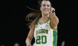 FILE - In this March 8, 2020, file photo, Oregon&#39;s Sabrina Ionescu (20) reacts after her team scored against Stanford during the second half of an NCAA college basketball game in the final of the Pac-12 women&#39;s tournament in Las Vegas. New York Liberty star Sabrina Ionescu is checking in periodically from the WNBA bubble at IMG Academy. She is offering her thoughts on her rookie season at the WNBA bubble as told to AP Basketball Writer Doug Feinberg. (AP Photo/John Locher, File)