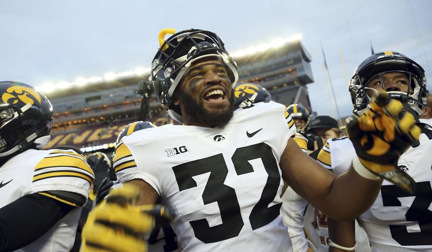 Iowa's Djimon Colbert celebrates after his team's 48-31 win against Minnesota after an NCAA college football game Saturday, Oct. 6, 2018, in Minneapolis. The death of George Floyd followed by revelations of mistreatment of Black players in the Iowa football program prompted Djimon Colbert to confront important issues he had mostly put to the side before this summer, Thursday, July 16, 2020. (AP Photo/Stacy Bengs)