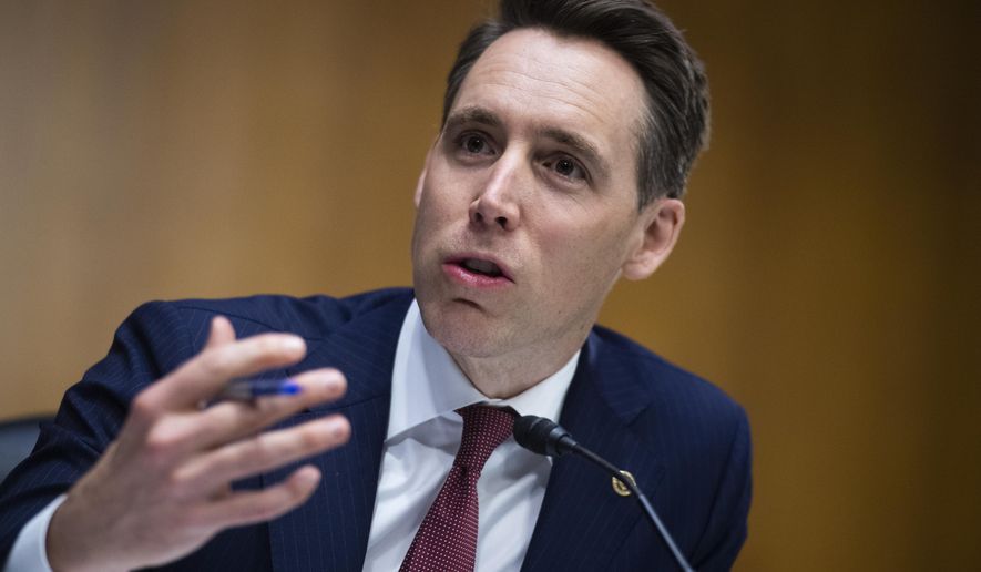 In this June 16, 2020 file photo, Sen. Josh Hawley, R-Mo., speaks on on Capitol Hill, in Washington. Mr. Hawley is among other Republicans and conservative activists hitting back at left-wing criticism of federal judge Amy Coney Barrett&#39;s adoption of two Haitian children. (Tom Williams/CQ Roll Call/Pool via AP File)  **FILE**