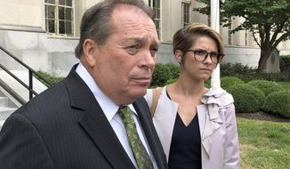 FILE - In this Sept. 12, 2018, file photo, Jerry Lundergan, father of Kentucky Secretary of State Alison Lundergan Grimes, leaves the federal courthouse with his attorney Whitney True Lawson, in Lexington, Ky. Kentucky businessman and Democrat Party stalwart Jerry Lundergan, 73, was sentenced on Thursday, July 16, 2020, to 21 months in prison for making illegal contributions to the failed U.S. Senate campaign of his daughter. (AP Photo/Adam Beam, File)