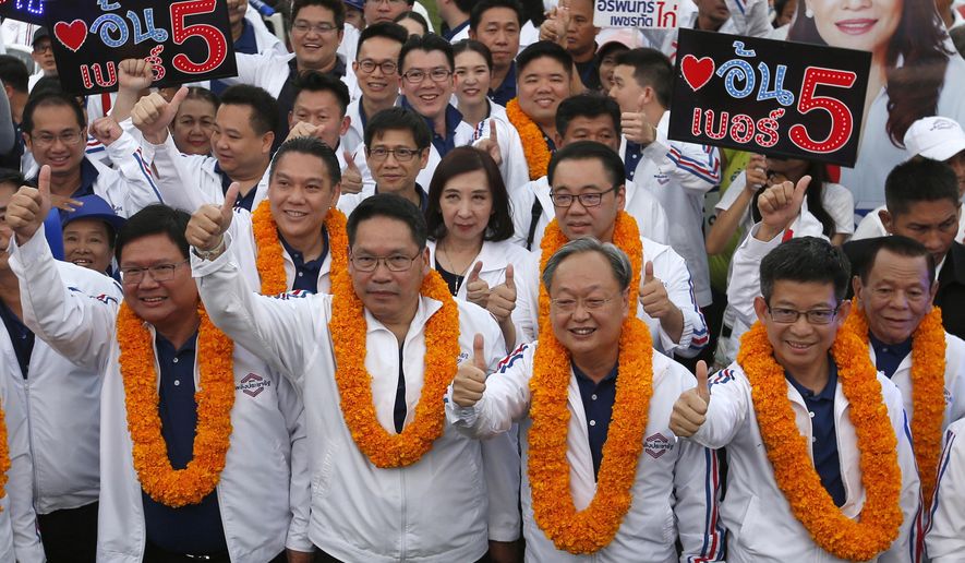 FILE - in this March 22, 2019, file photo, from left to right, Thailand's Suwit Mesinsee, Uttama Savanayana, Sontirat Sontijirawong and Kobsak Pootrakul, arrive for a campaign rally ahead of general elections in Bangkok, Thailand. Four key ministers in Cabinet announced their resignations Thursday, July 16, 2020 as a military clique within the ruling party continues to consolidate power. The most prominent member to depart was Somkid, a deputy prime minister who has been in several governments during the past 19 years and who has been overseeing recent economic stimulus packages. (AP Photo/Sakchai Lalit, File)