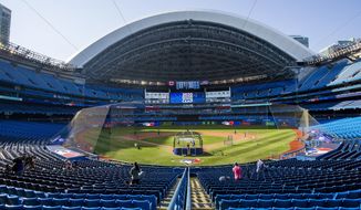 The Toronto Blue Jays take batting practice before an intrasquad baseball game in Toronto on Thursday, July 9, 2020. (Carlos Osorio/The Canadian Press via AP)