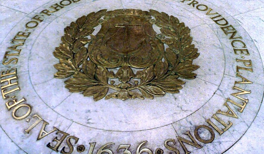 FILE - This Jan. 21, 2000 file photo shows the seal of the State of Rhode Island and Providence Plantations on the floor of the Statehouse rotunda in Providence, R.I. On Thursday, July 16, 2020, state lawmakers approved placing a question on the November ballot to allow voters the option to remove "and Providence Plantations" from the state's official name. (AP Photo/Susan E. Bouchard, File)