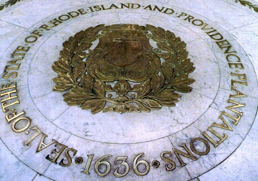FILE - This Jan. 21, 2000 file photo shows the seal of the State of Rhode Island and Providence Plantations on the floor of the Statehouse rotunda in Providence, R.I. On Thursday, July 16, 2020, state lawmakers approved placing a question on the November ballot to allow voters the option to remove "and Providence Plantations" from the state's official name. (AP Photo/Susan E. Bouchard, File)